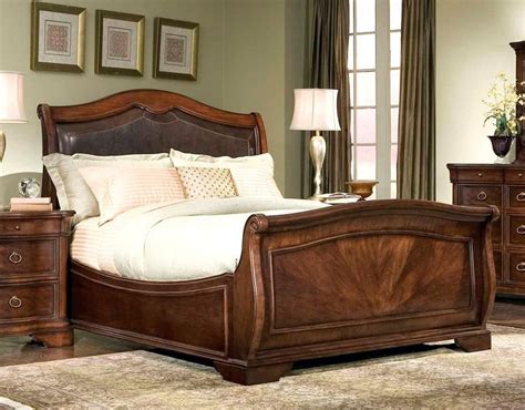 A hanging brown leather headboard stands out in the navy. Heritage Court Sleigh Bed w Leather Headboard in Cocoa ...