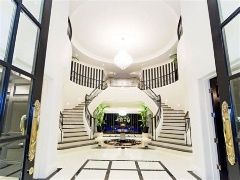 Large arched window above the front door along with skylights in the hall flood the space with light. $17.5 Million Newly Listed Modern Mansion In Queensland ...