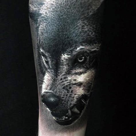 Black and grey wolf and cinderella making circle tribal tattoo. 50 Realistic Wolf Tattoo Designs For Men - Canine Ink Ideas