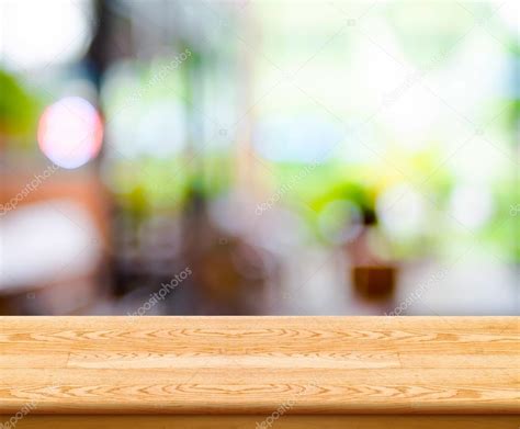Empty Wood Table Top With Coffee Shop Blur With Bokeh