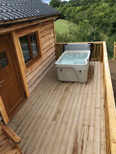 Four romantic one bedroom log cabins located on 20 partially wooded country acres, each with a gas log fireplace and a hot tub on the covered porch. log cabin with private hot tub with breath taking views ...