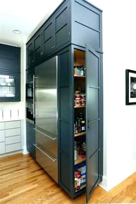 I was originally going to leave this area open until a later date, but after the rest of the kitchen was done, it needed a cabinet above the fridge and there was no way around it! hidden refrigerator hidden fridge in kitchen refrigerator ...