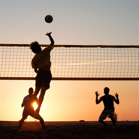 Download Beach Volleyball Men Silhouette At Sunset Wallpaper