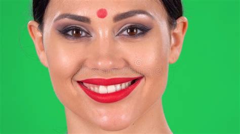 Portrait Of Beautiful Indian Woman With Red Dot On Forehead Looking At