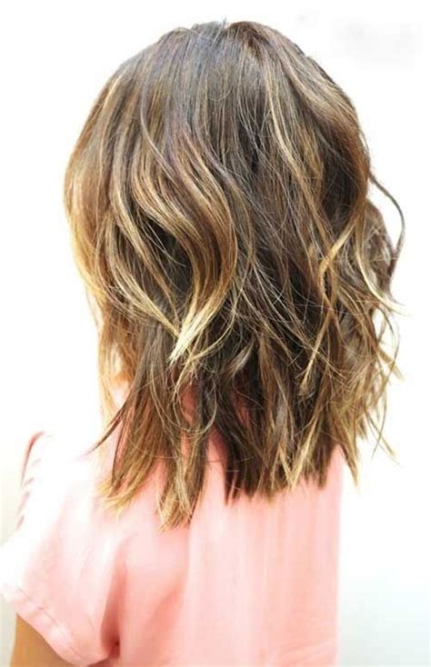 The razored ends and the tousled top with bangs do a wonderful job of providing lift and added texture to flat fine hair. Best Beachy Waves for Short to Medium Length Hairstyles ...