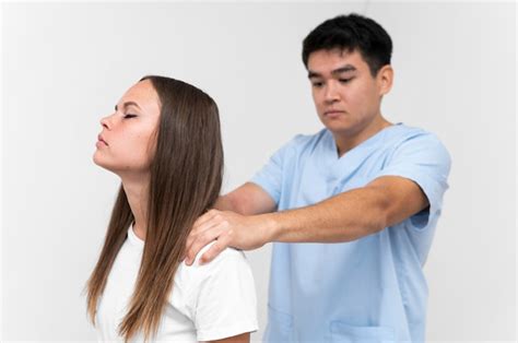Premium Photo Physiotherapist Massaging Female Patients Shoulders