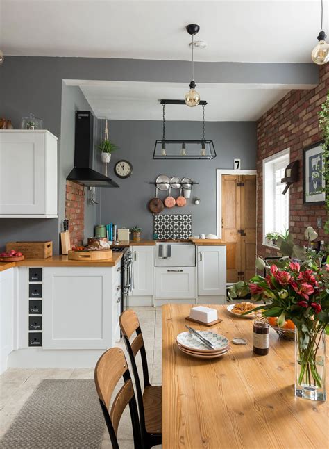 Shaker Style Kitchen With Grey Walls A Wooden Dining Table Wooden