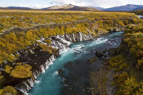 Aerial View Of Autumn Foliage At Hraunfossar Waterfalls In Husafell