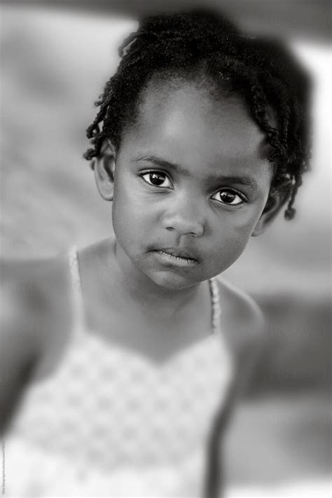 Portrait Of African American Little Girl With Serious Expression By