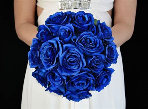 The bridal bouquets consisted of burnt orange roses, burnt orange gerbera daisies, orange hydrangeas, lamb's ear and thistles. Royal Blue Wedding Flower Package