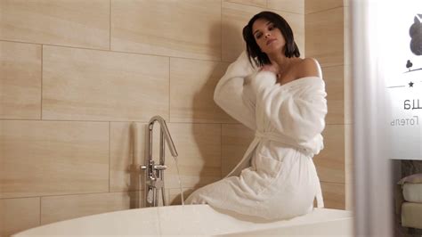 Woman Sitting On Bathtub In Bathroom Stock Footage SBV Storyblocks