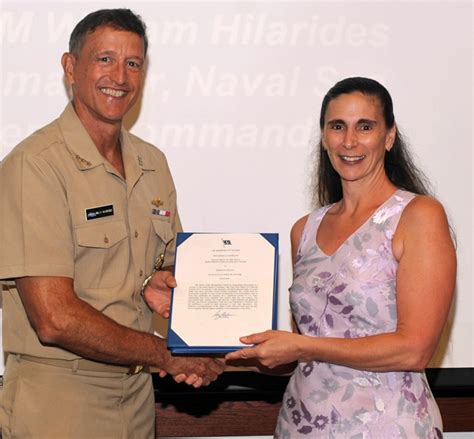 Vadm Hilarides Presents Navy Meritorious Civilian Service Awards At