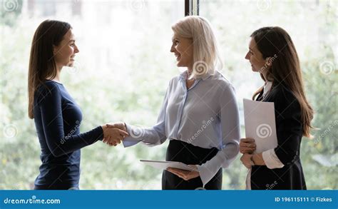 Smiling Businesswoman Handshake Female Employee In Office Stock Image
