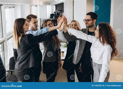 Happy Successful Multiracial Business Team Giving A High Fives Gesture