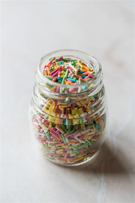 Jar Of Colorful Sugar Sprinkles In Glass Bottle Stock Photo Image Of