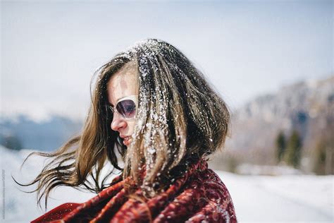 Woman With Snow In Her Hair By Stocksy Contributor Michela Ravasio