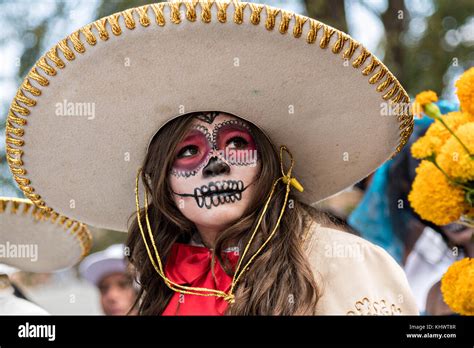A Young Woman Dressed In La Calavera Catrina Costume During The Day Of