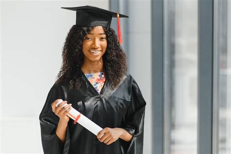 Premium Photo Cheerful African American Female Graduate Standing In