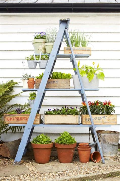 I love the rusty angel with the aged patina of the wood. Step-by-Step Instructions to DIY a Ladder Planter Stand