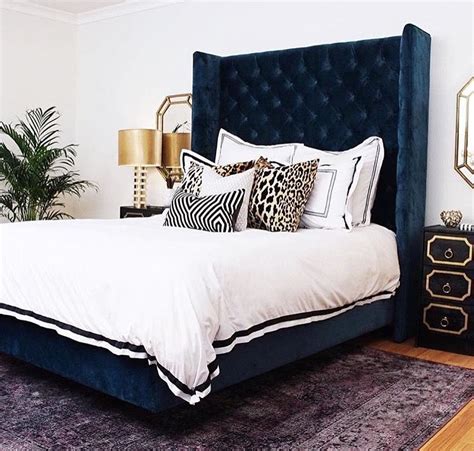 Bedroom With Blue Upholstered Bed