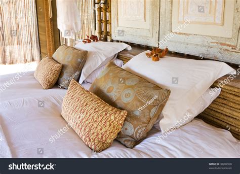 Landscape Image Of A Bedroom Scene Focusing On The Pillows Stock