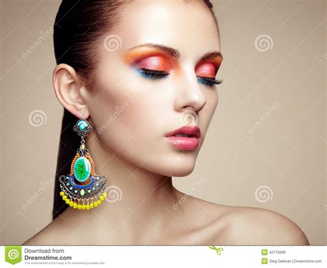 Portrait Of Beautiful Young Woman With Earring Jewelry And Accessories