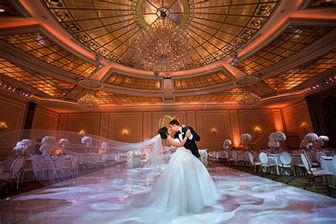 This glamorous 4,000 square foot banquet hall features stunning chandeliers, led lighting, customized decor, and a sprawling wooden dance floor. Los Angeles Wedding Venue | Taglyan Complex