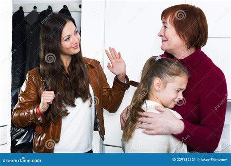 Woman Saying Goodbye To Her Mother And Upset Daughter Stock Image