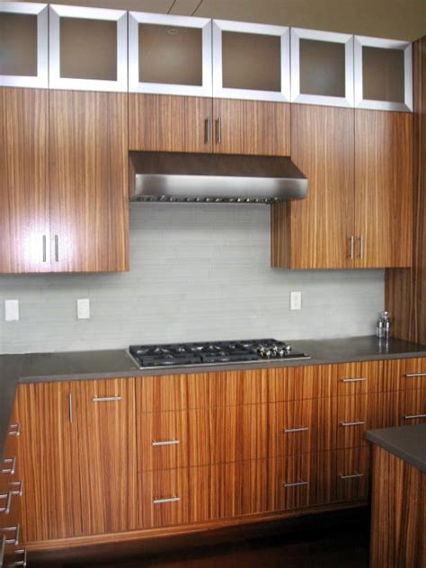 The modern look of kitchen cabinet also shows the minimalist and elegant place. Modern Kitchen With Zebra Wood and Stainless Steel ...