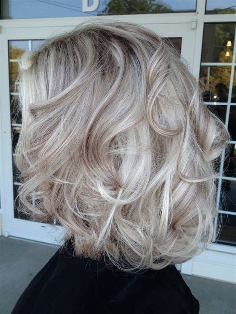 Icy blonde usually refers to an extra cool blonde hair color… and may almost have a silvery feel to it. Silver hair dye on blonde hair | Nail Art Styling