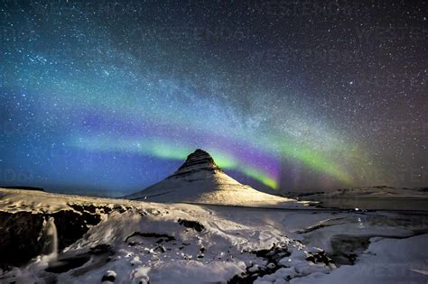 Amazing View Of Aurora Borealis Glowing In Night Sky With Stars Over
