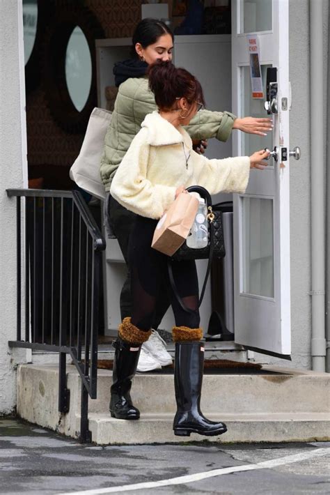 Sarah Hyland In A Black Rubber Boots Was Seen Out In La