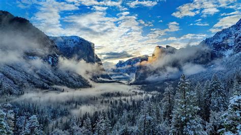 1366x768 Fog And Clouds Over Snowy Winter Mountain 4k 1366x768