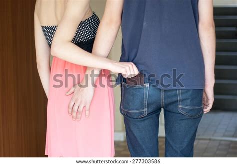 Стоковая фотография Man Grabbing Womans Ass She Takes