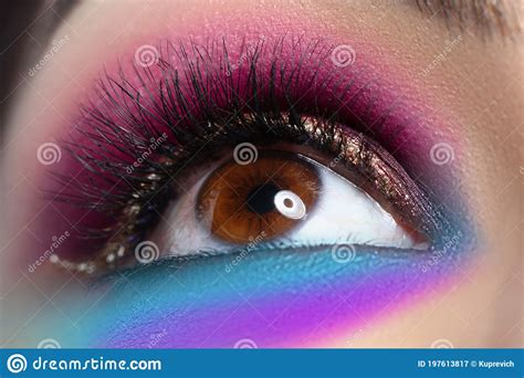 Beautiful Brown Eye With Bright Makeup Looks Up In Closeup Stock Image