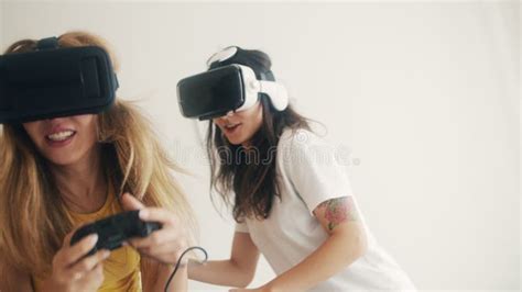 Exited Girls In VR Helmets At Home Two Women In Virtual Reality