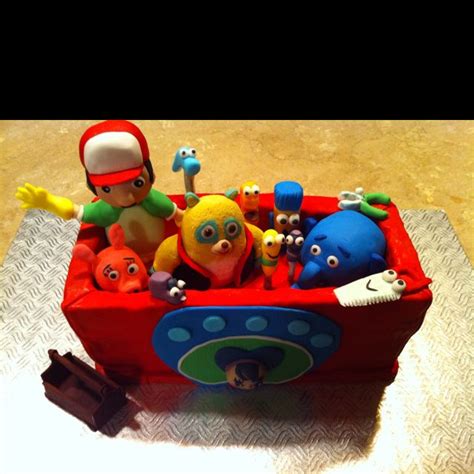 A Toy Boat Filled With Toys On Top Of A Table
