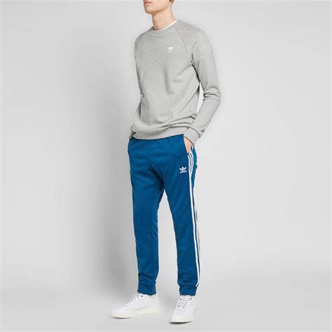 Half of the iconic adidas track suit, for those who want to get full of comfort. Adidas SST Track Pant Legend Marine | END.
