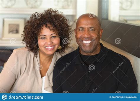 Portrait Of A Mature Mixed Race Couple Smiling Stock
