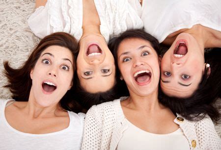 Group Of Surprised Women Lying On The Floor Making Faces Freestock Photos