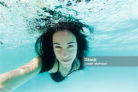Closeup Of Beautiful Woman Swimming Underwater Stock Photo Download
