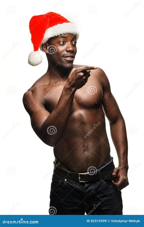 Muscular Black Shirtless Young Man In Santa Claus Hat Stock Image