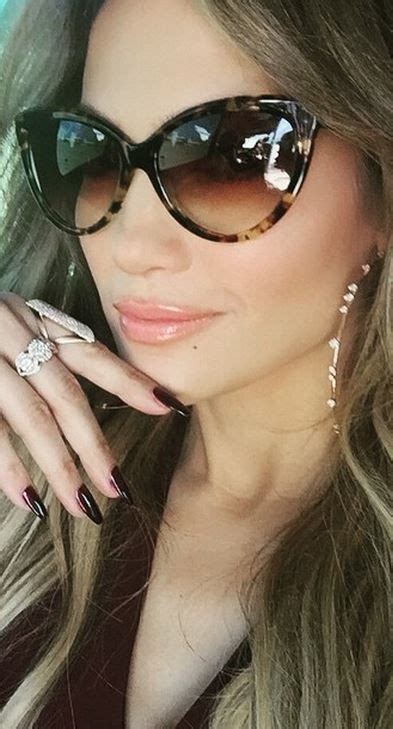 Who Made Jennifer Lopezs Brown Cat Sunglasses And Diamond Hoop Earrings