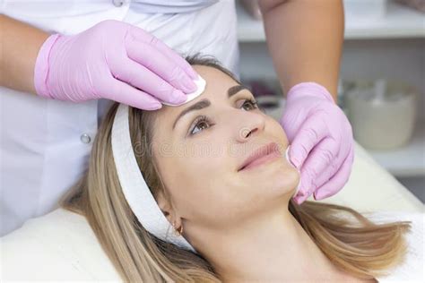 Cosmetology Young Woman With Receiving Facial Cleansing Procedure