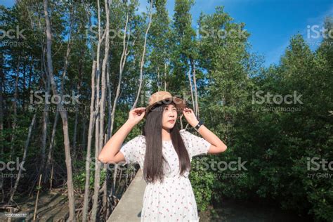 Beautiful Young Asian Girl Smiling To Camera Enjoy Vacation At Tropical
