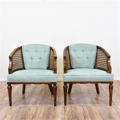 You'll love its woven accents and light, neutral hues. These cane back barrel chairs are featured in a solid wood ...