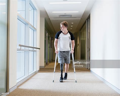 Young Man With Prosthetic Leg On Crutches High Res Stock Photo Getty