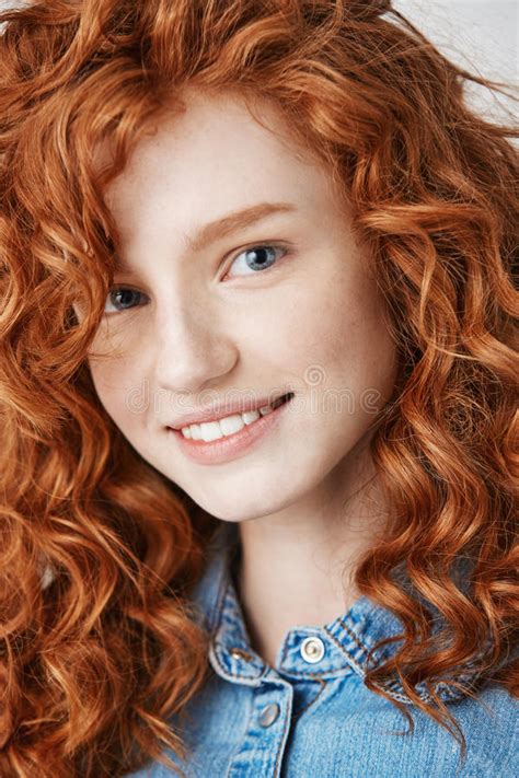 Close Up Of Redhead Beautiful Girl With Freckles Smiling