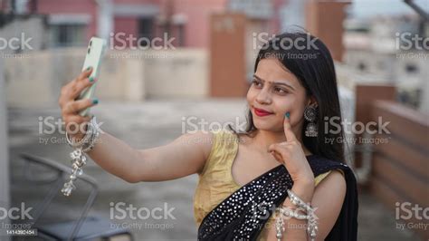 Beautiful Indian Girl Taking Selfie On Her Mobile Phone Outdoor