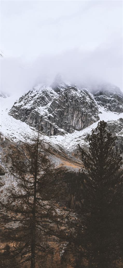 Snow Capped Rocky Mountain Under Cloudy Sky Iphone X Wallpapers Free